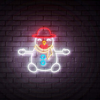 Sitting Snowman NEON LED Sign on a brick wall, featuring colorful LED lights and playful design.