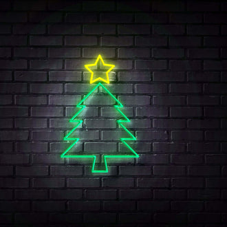 Plain Christmas Tree NEON LED Sign glowing in green with a yellow star on a dark brick wall.