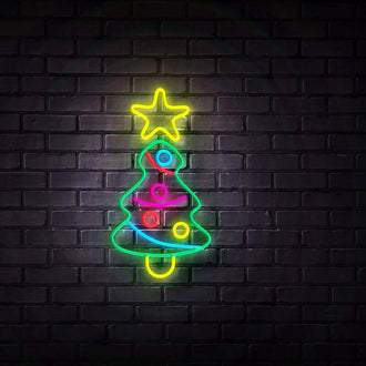 Decorated Christmas Tree NEON LED Sign glowing brightly against a dark brick wall.
