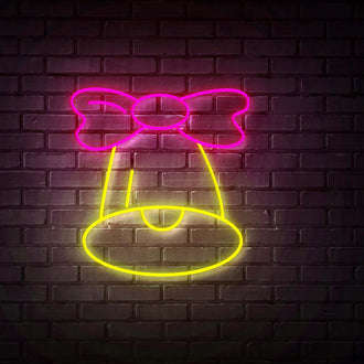Bell with Pink Ribbon NEON LED Sign illuminating a brick wall with vibrant colors.