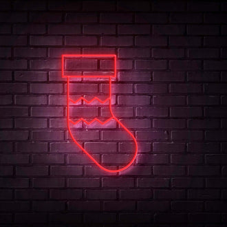 Stocking NEON LED Sign glowing against a dark brick wall, ideal for customizable neon decor.