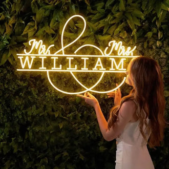 Custom Mr and Mrs neon sign with name William, perfect for wedding reception backdrop and decoration.