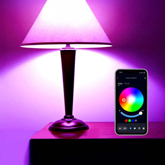 Smart LED bulb with color-changing feature, controlled via Tuya app on smartphone, set in ambient lighting.