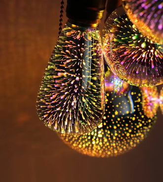 3D Fireworks LED Edison Bulb showcasing intricate starburst effects and vibrant colors in a decorative lighting setting.