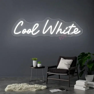 Custom LED neon sign 'Cool White' illuminating a stylish living room with modern decor.