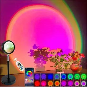 Tuya Smart Sunset Projector Lamp with colorful light effects, remote, and vibrant plants for cozy ambiance.