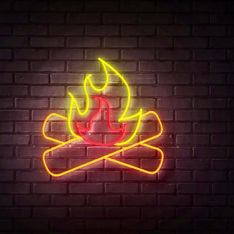 Yellow Fireplace NEON LED Sign on a brick wall, featuring vibrant neon flames and logs.