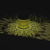 Peony Solar Wall Lamp (Single) casting beautiful floral patterns on the ground at night.